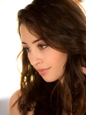 unbuttons her pink top